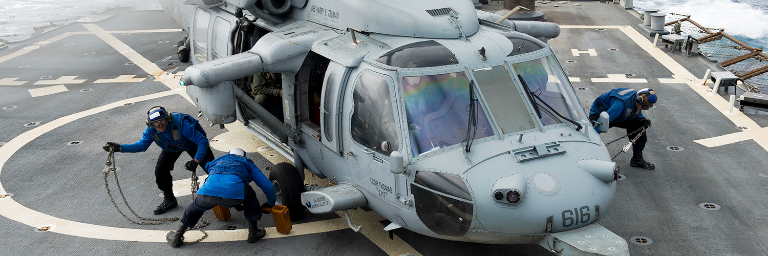 Sailors prepare an MH-60S Sea Hawk helicopter assigned to the Night Dippers of Helicopter Sea Combat Squadron. U.S. Navy photo by Mass Communication Specialist 3rd Class Pasquale Sena/Released.